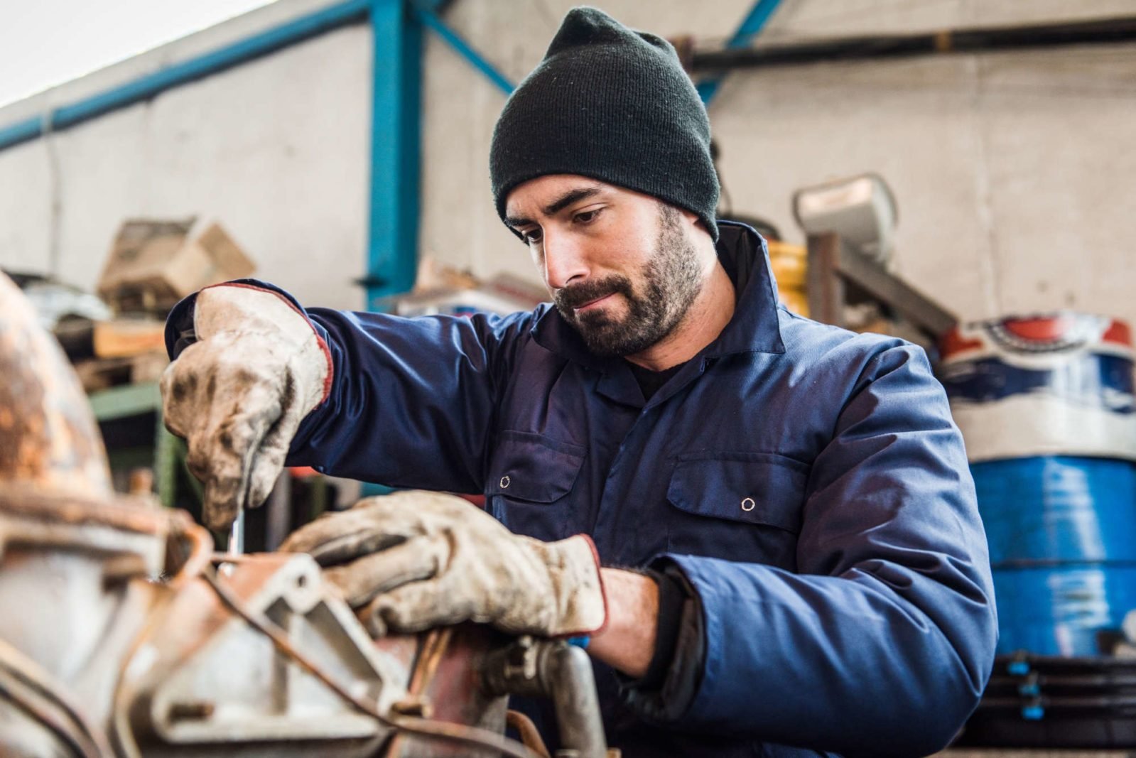 repairman worker repairing a engine excavator