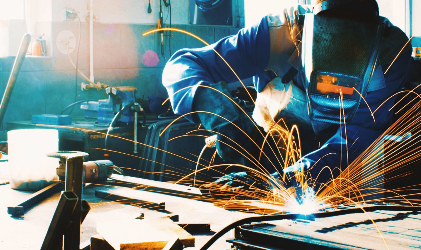 Welding two pieces of metal.