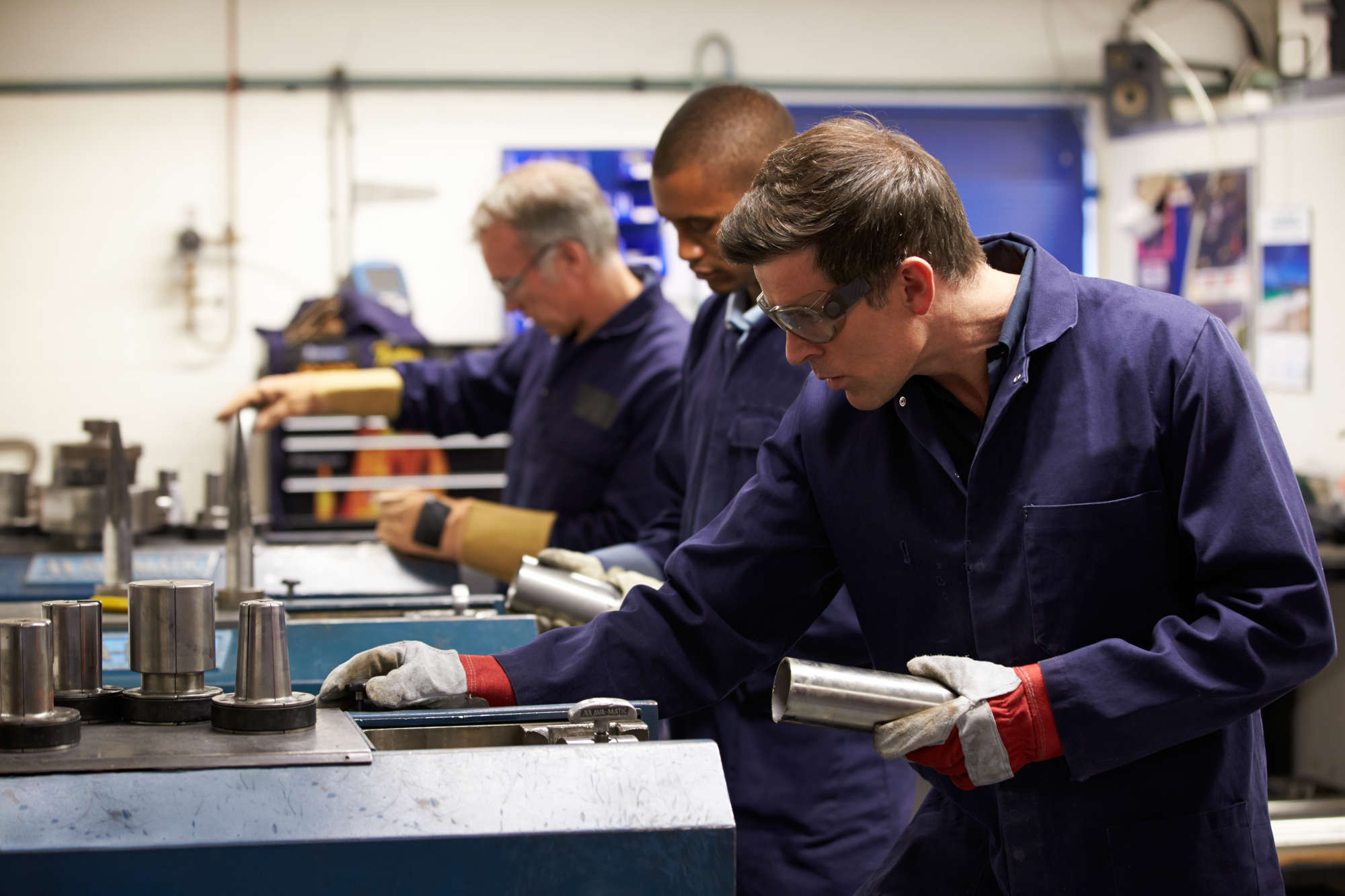 manufacturing employees working on machines