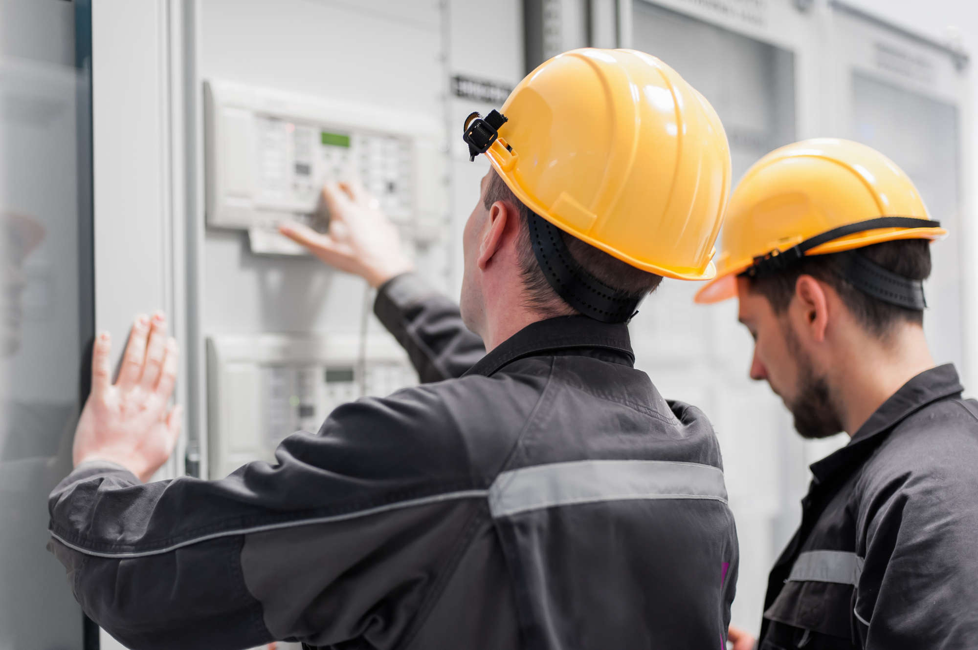 two men checking system settings